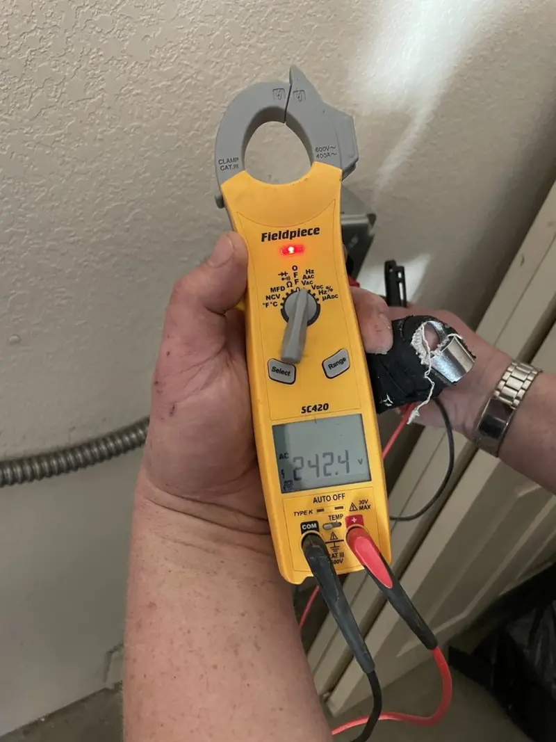Voltage testing with clamp meter during Hot Tub / Pool Electrical Wiring in Falls City